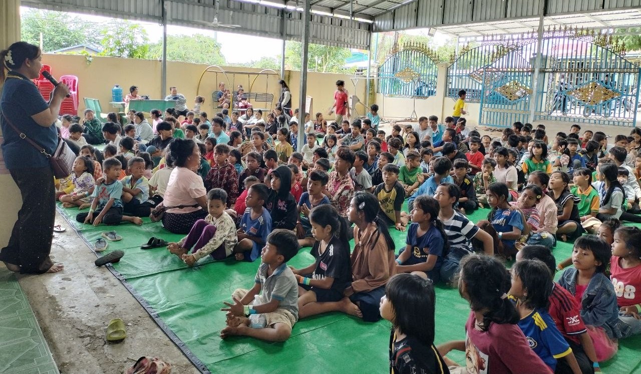 Cambodian children seated on mats at a new church outreach in Prum, September 2026